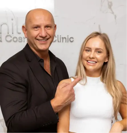 Happy patient consulting with a dental professional about wisdom teeth removal at D'vine Smiles Cosmetic Clinic.